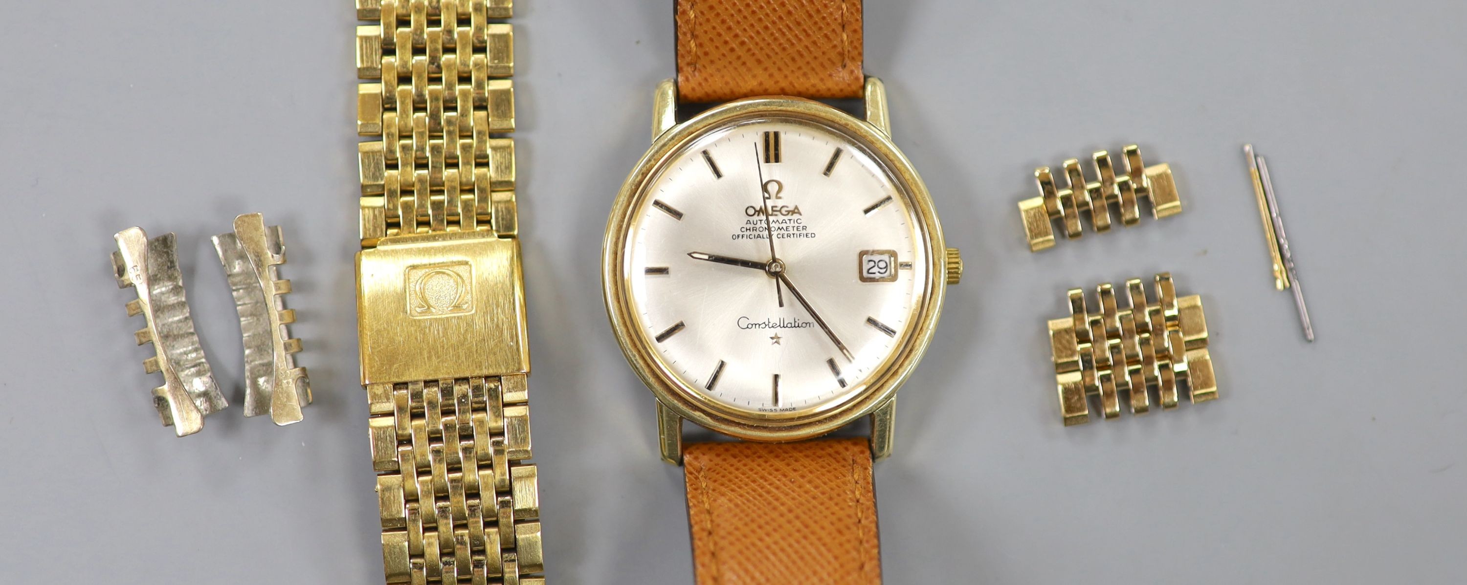 A gentleman's steel and gold plated Omega Constellation automatic wrist watch, on Omega leather strap, with spare Omega gold plated bracelet also, case diameter 35mm, with Omega box.